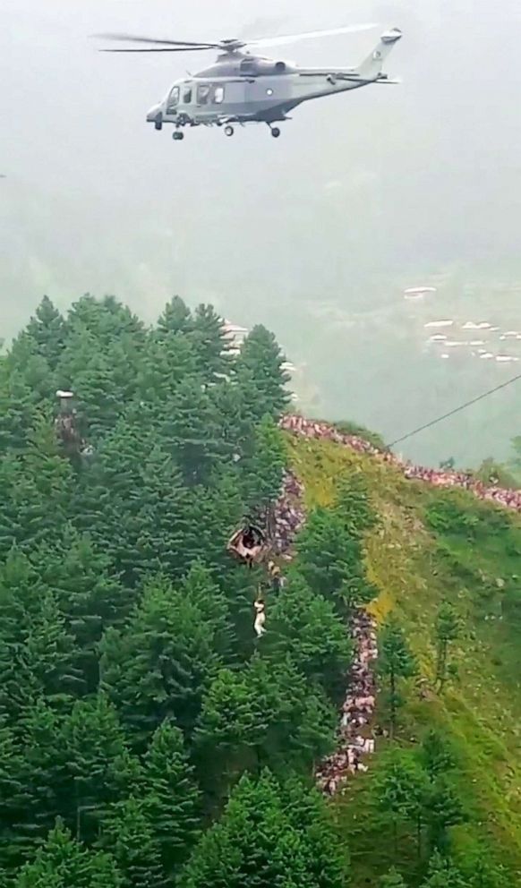 PHOTO: A helicopter rescues a person following a cable car with students stranded mid-air in Battagram, Pakistan, Aug. 22, 2023.