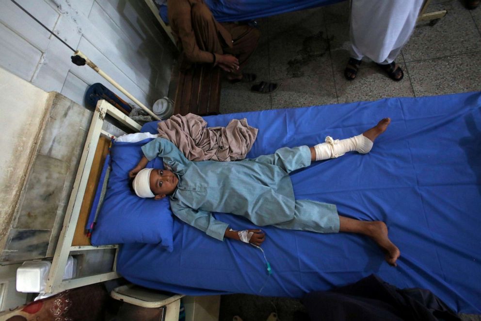 PHOTO: An Injured boy lies on the bed at a hospital after Sunday's suicide bomber attack, in the Bajur district of Khyber Pakhtunkhwa, Pakistan, Monday, July 31, 2023.