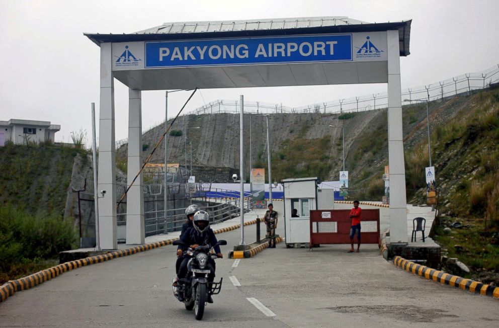 PHOTO: People ride a motorbike as they leave Pakyong Airport, the northeastern Sikkim State's first airport, after its inauguration by Prime Minister Narendra Modi in Pakyong, India Sept. 24, 2018.