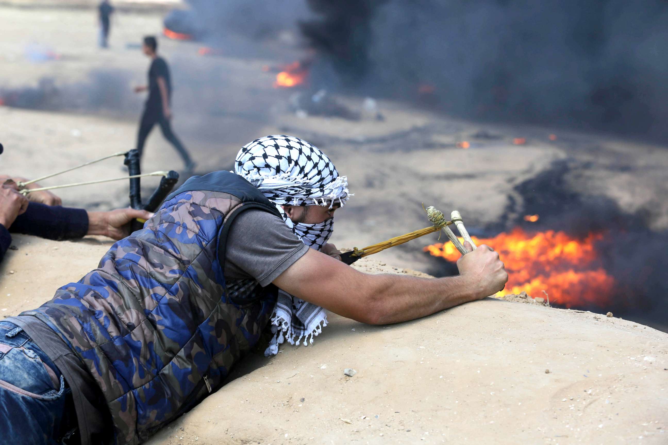 PHOTO: Palestinian protesters gather during clashes with Israeli security forces in a tent city protest where Palestinians demand the right to return to their homeland, in Khan Younis in the southern Gaza Strip, May 15, 2018.