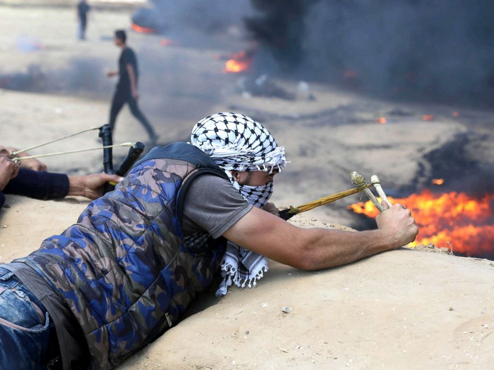 PHOTO: Palestinian protesters gather during clashes with Israeli security forces in a tent city protest where Palestinians demand the right to return to their homeland, in Khan Younis in the southern Gaza Strip, May 15, 2018.