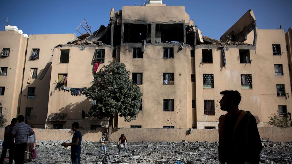 PHOTO: Palestinians inspect the damage of a destroyed building following a late night Israeli missile strike in town of Beit Lahiya, Northern Gaza Strip, May. 6, 2019.