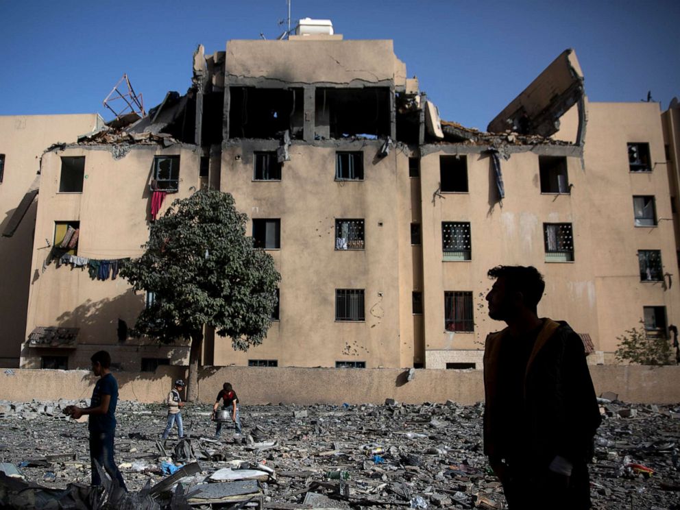 PHOTO: Palestinians inspect the damage of a destroyed building following a late night Israeli missile strike in town of Beit Lahiya, Northern Gaza Strip, May. 6, 2019.