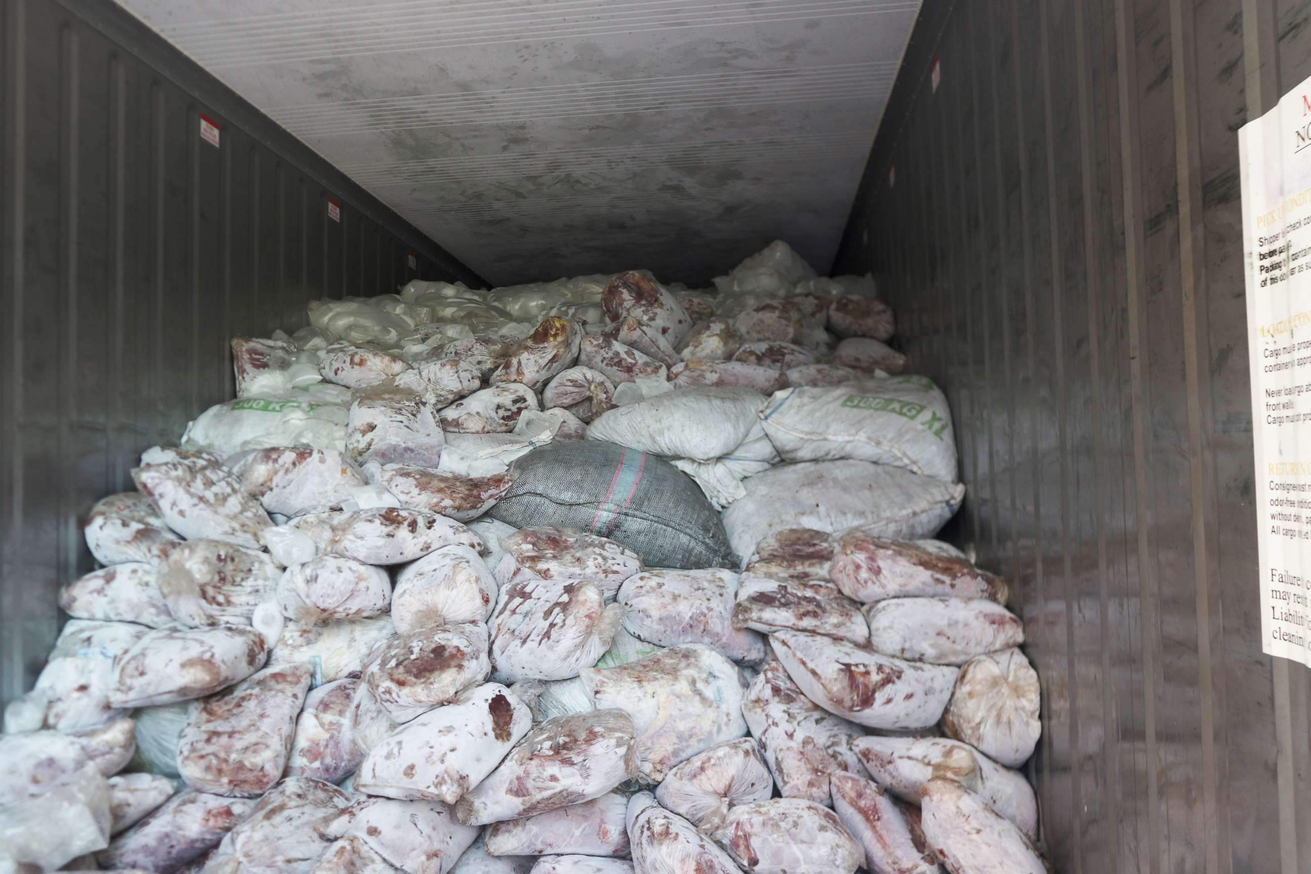 PHOTO:Sacks of pangolin scales mixed with packs of frozen meat in a container van in Singapore, April 3, 2019.