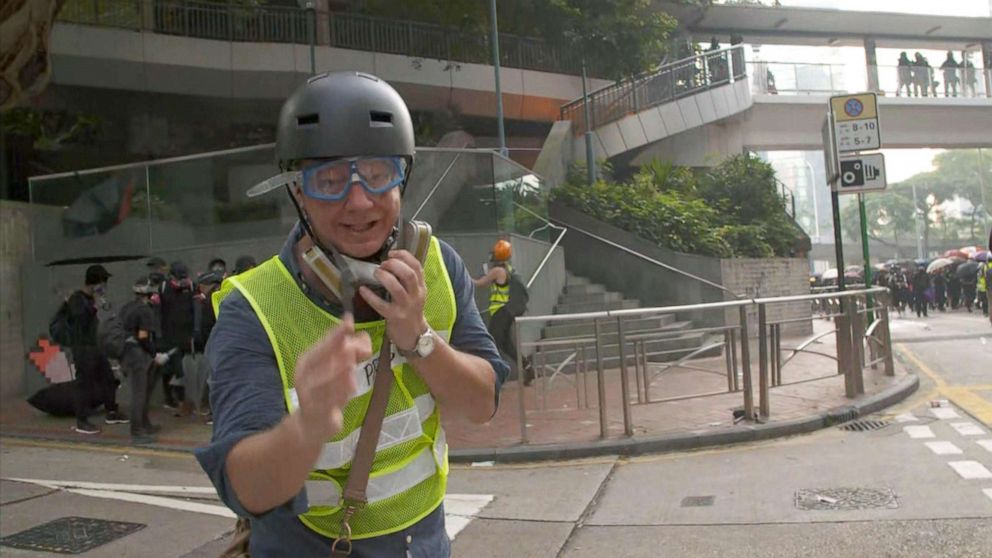 PHOTO: ABC's Ian Pannell reports during the protests in Hong Kong, Oct. 1, 2019, wearing a high-visibility vest with "Press" on it.