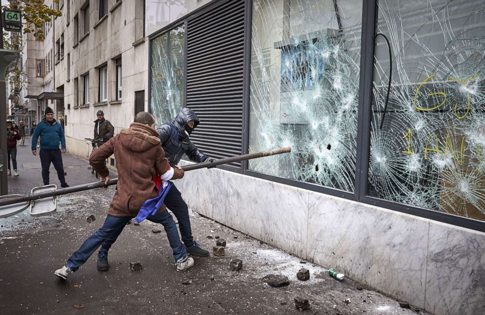 PHOTO: Black Bloc and Gilets Jaunes, or yellow vest protestors vandalize a branch of HSBC in Place d'Italie as protests turn violent with thousands of protesters converging on the French capital.