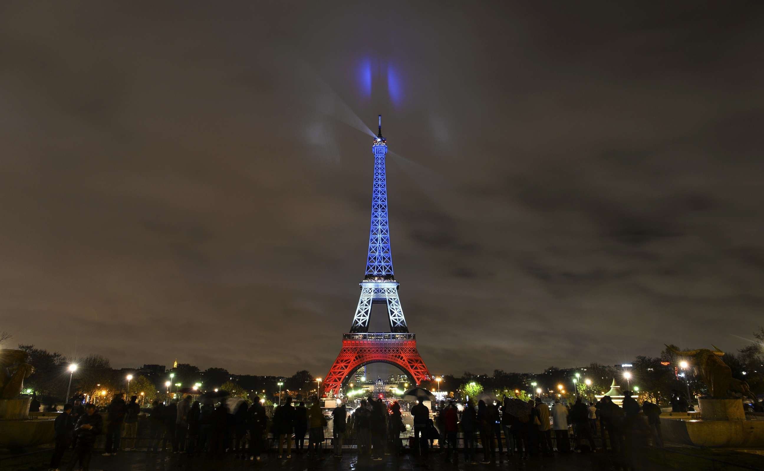 PHOTO: The Eiffel Tower is illuminated in the colors of the French flag to honor victims of Paris attacks, Nov. 17, 2015, in Paris.