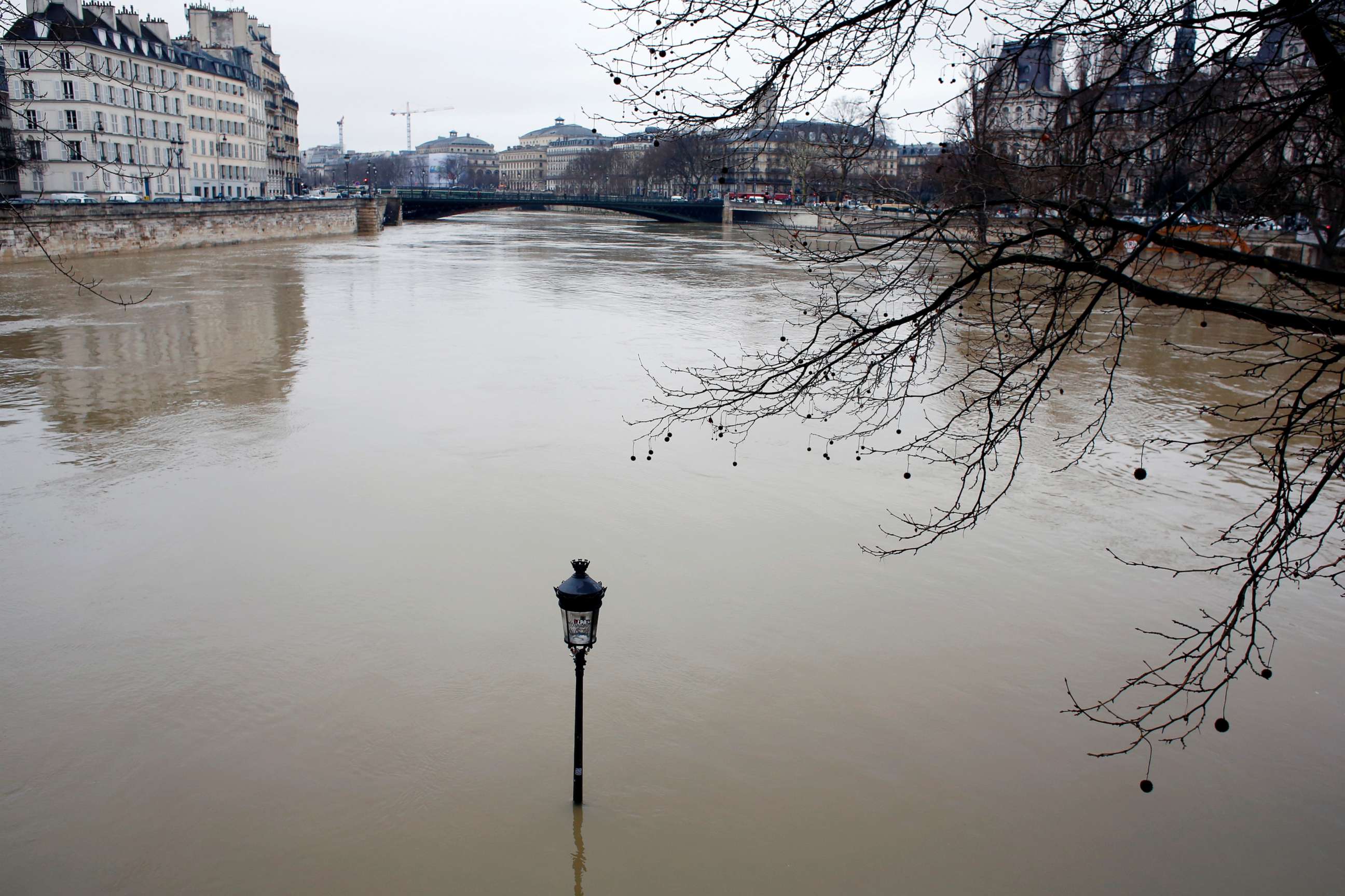 PHOTO: A flooded street lamp is pictured in Paris, Jan.23, 2018.