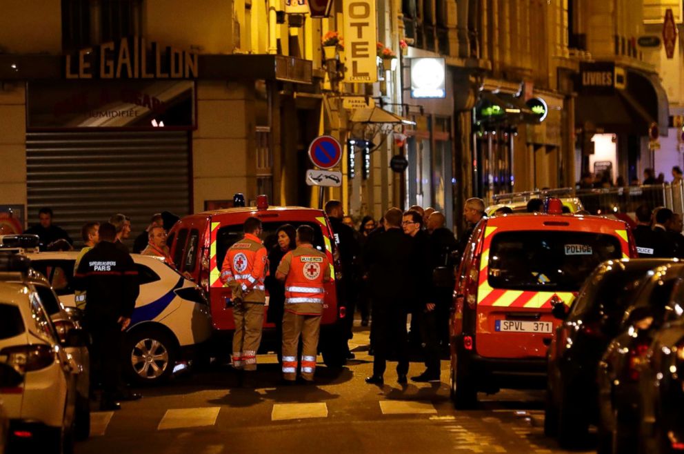 PHOTO: Mayor of Paris Anne Hidalgo (C) talks to emergency service members in a street in Paris center after a knife attack in Paris, May 12, 2018.