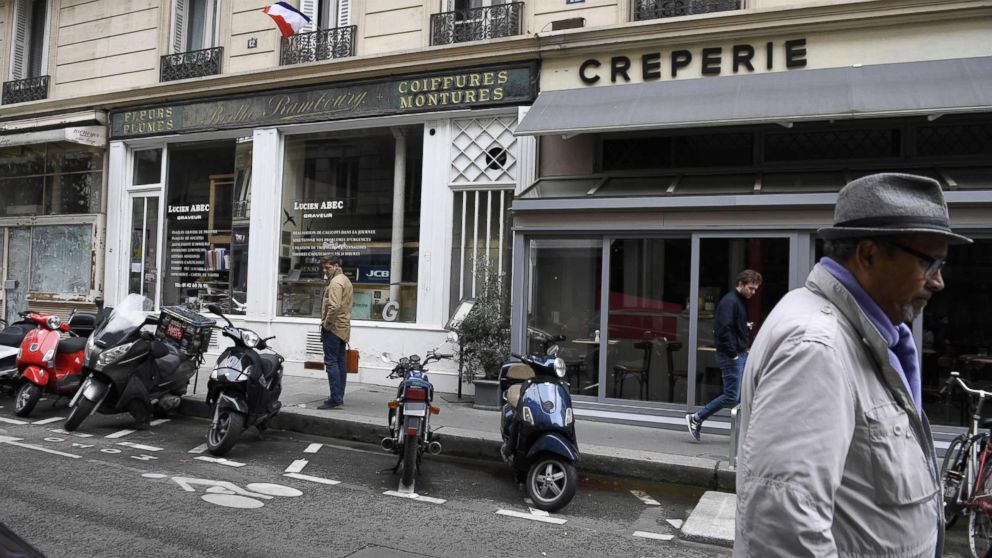 PHOTO: People walk on Monsigny street in Paris, May 13, 2018, on the site where a man attacked several people with a knife the night before.