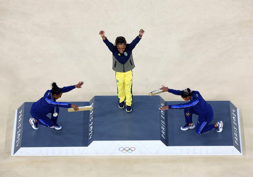 PHOTO: Gold medalist Rebeca Andrade of Brazil celebrates with silver medalist Simone Biles of the U.S. and bronze medalist Jordan Chiles of the U.S. following the women's artistic gymnastics floor exercise final at the 2024 Paris Olympics, Aug. 5, 2024.