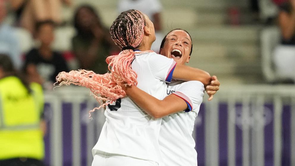 PHOTO: Trinity Rodman of the U.S. celebrates scoring with teammate Mallory Swanson against Zambia during their women's group B soccer match at the Paris 2024 Olympics, July 25, 2024, in Nice, France.