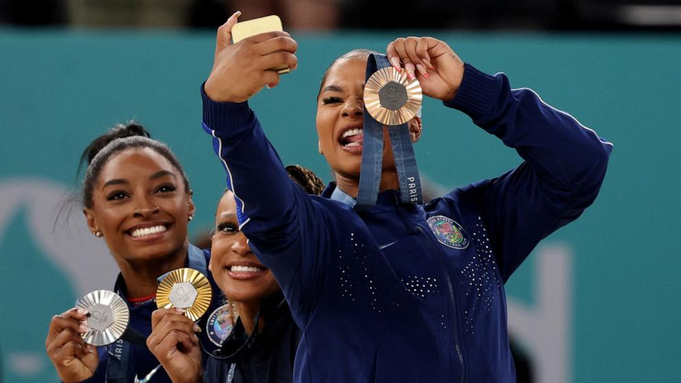 PHOTO: Gold medalist Rebeca Andrade of Brazil stands with silver medalist Simone Biles of the U.S and bronze medalist Jordan Chiles of the U.S. following the women's artistic gymnastics floor exercise final at the 2024 Paris Olympics, Aug. 5, 2024.