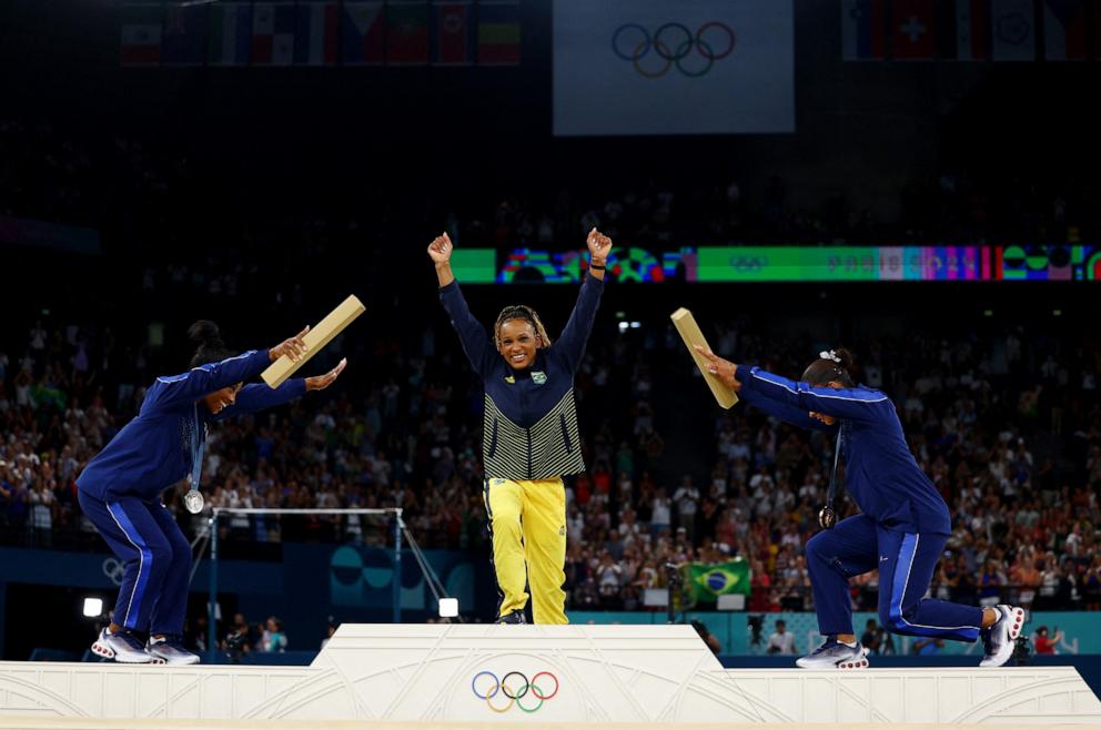 PHOTO: Silver medalist Simone Biles and bronze medalist Jordan Chiles of the U.S. bow to gold medalist Rebeca Andrade of Brazil following the women's artistic gymnastics individual floor exercise final at the 2024 Paris Olympics, Aug. 5, 2024.