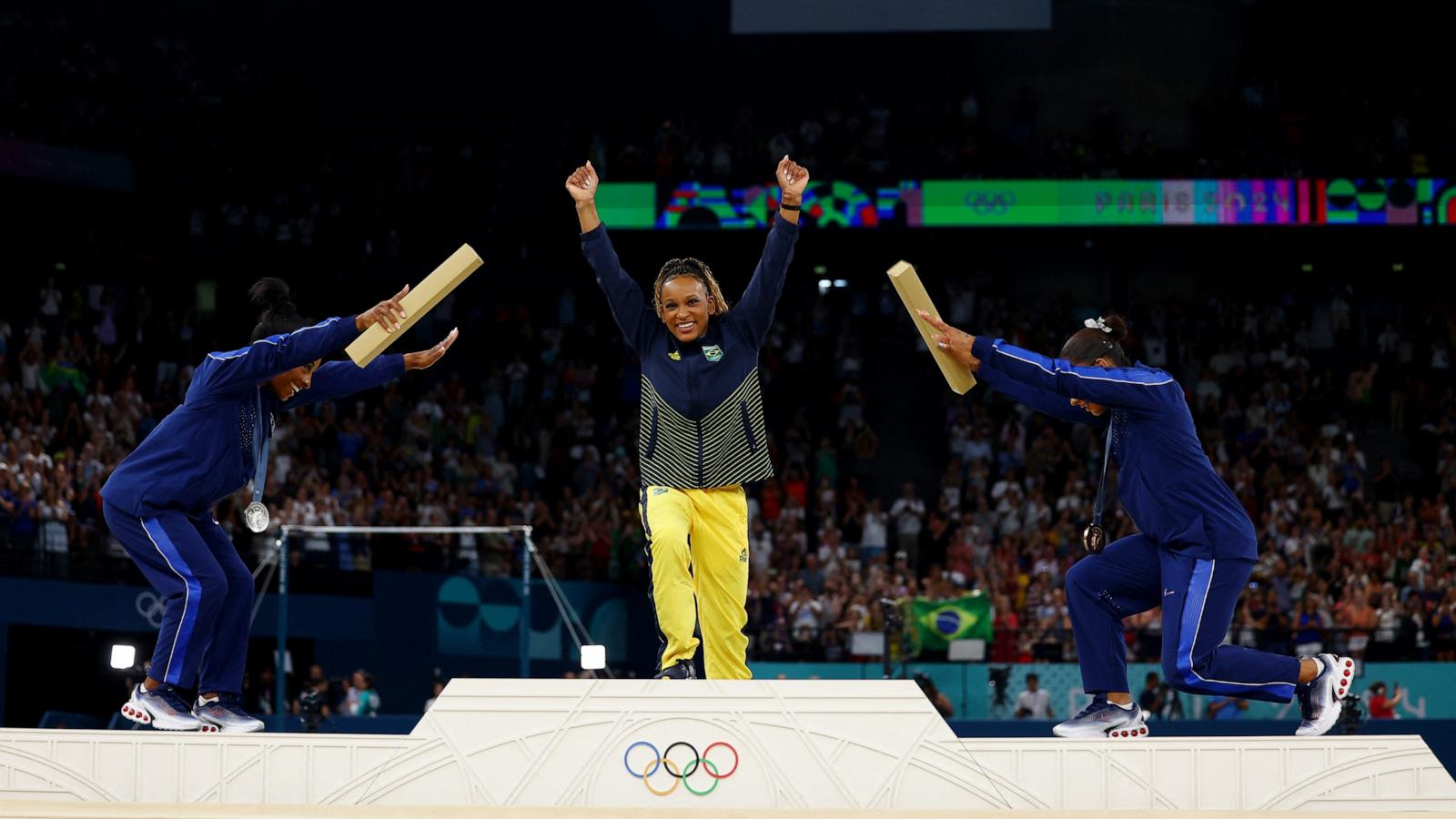 PHOTO: Silver medalist Simone Biles and bronze medalist Jordan Chiles of the U.S. bow to gold medalist Rebeca Andrade of Brazil following the women's artistic gymnastics individual floor exercise final at the 2024 Paris Olympics, Aug. 5, 2024.