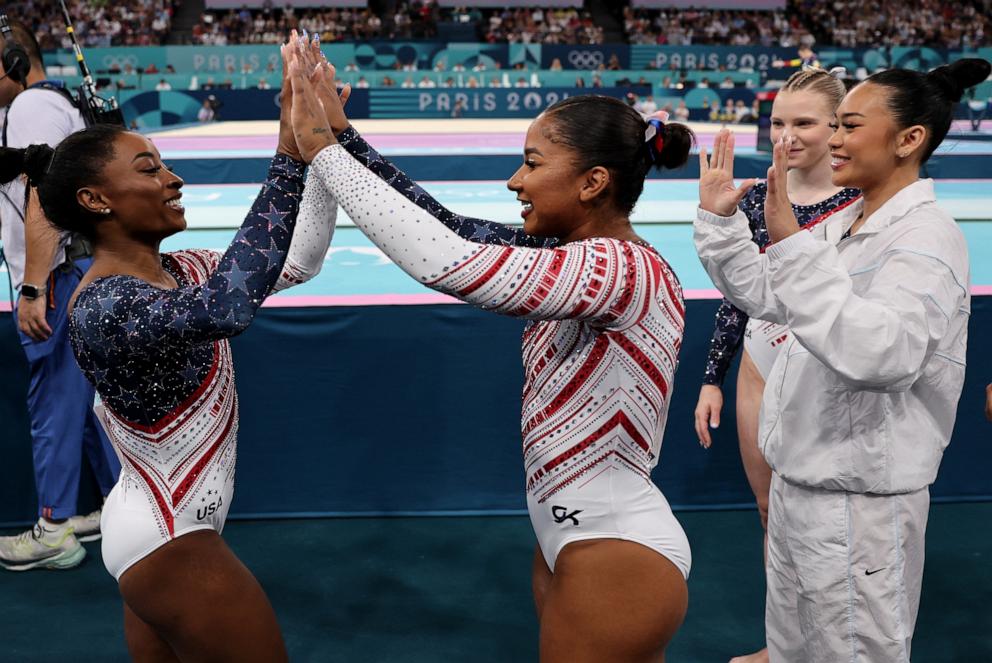 PHOTO: Simone Biles of the U.S. is congratulated by teammate Jordan Chiles competing on the vault during the artistic gymnastics women's team final at the 2024 Paris Olympics, July 30, 2024.