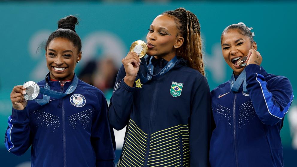 PHOTO: Silver medalist Simone Biles of the U.S, gold medalist Rebeca Andrade of Brazil, and bronze medalist Jordan Chiles of the U.S pose after the women's artistic gymnastics individual floor exercise final at the 2024 Paris Olympics, Aug. 5, 2024.