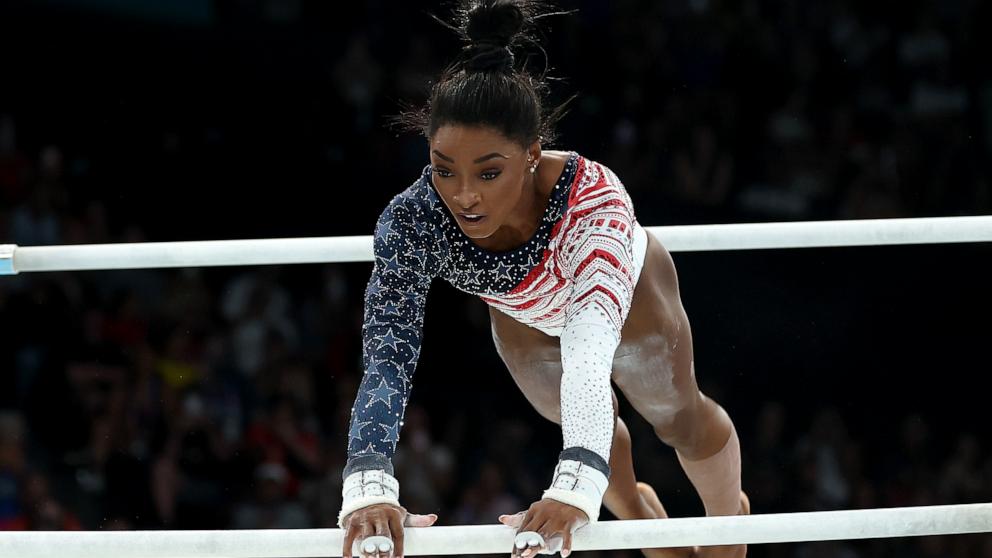 PHOTO: Simone Biles of the U.S. competes on the uneven bars during the artistic gymnastics women's team final at the 2024 Paris Olympics, July 30, 2024.