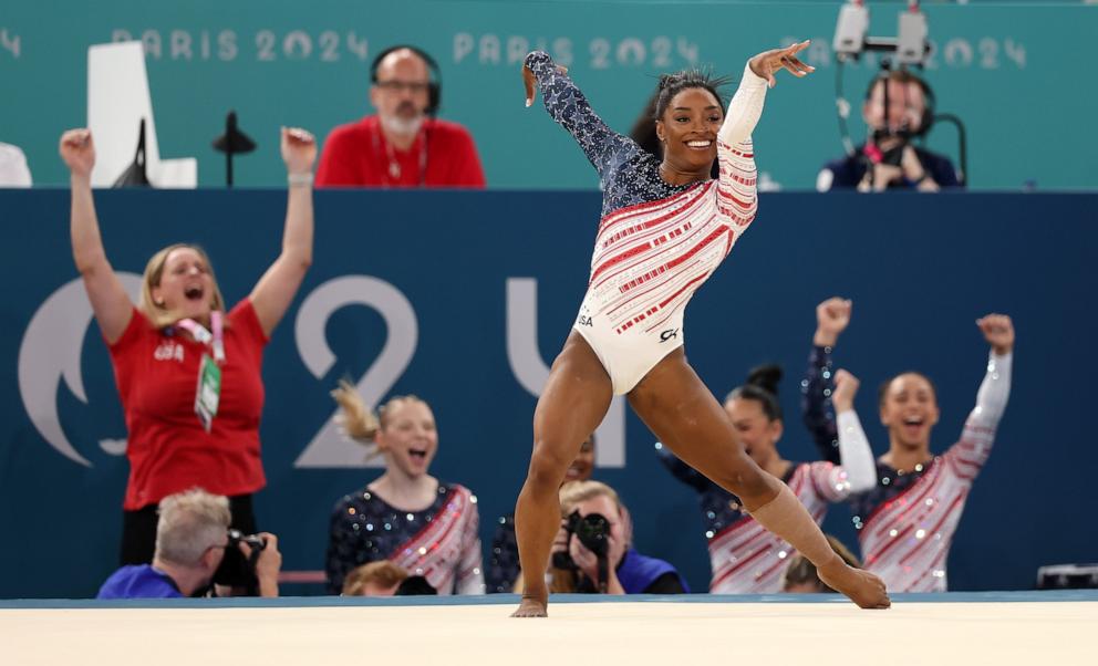 PHOTO: Simone Biles of the U.S celebrates with her teammates behind her after competing in the floor exercise during the artistic gymnastics women's team final at the 2024 Paris Olympics, July 30, 2024.