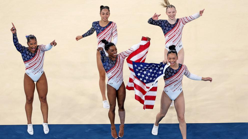 PHOTO: Jordan Chiles, Hezly Rivera, Simone Biles, Sunisa Lee and Jade Carey of the U.S. celebrate after winning the gold medal during the artistic gymnastics women's team final at the 2024 Paris Olympics, July 30, 2024.