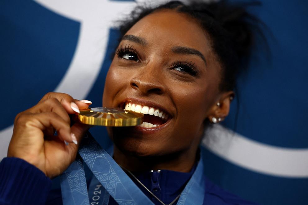 PHOTO: Gold medalist Simone Biles of the U.S. poses with her medal during the podium ceremony after the artistic gymnastics women's all-around final at the 2024 Paris Olympics, Aug. 1, 2024.