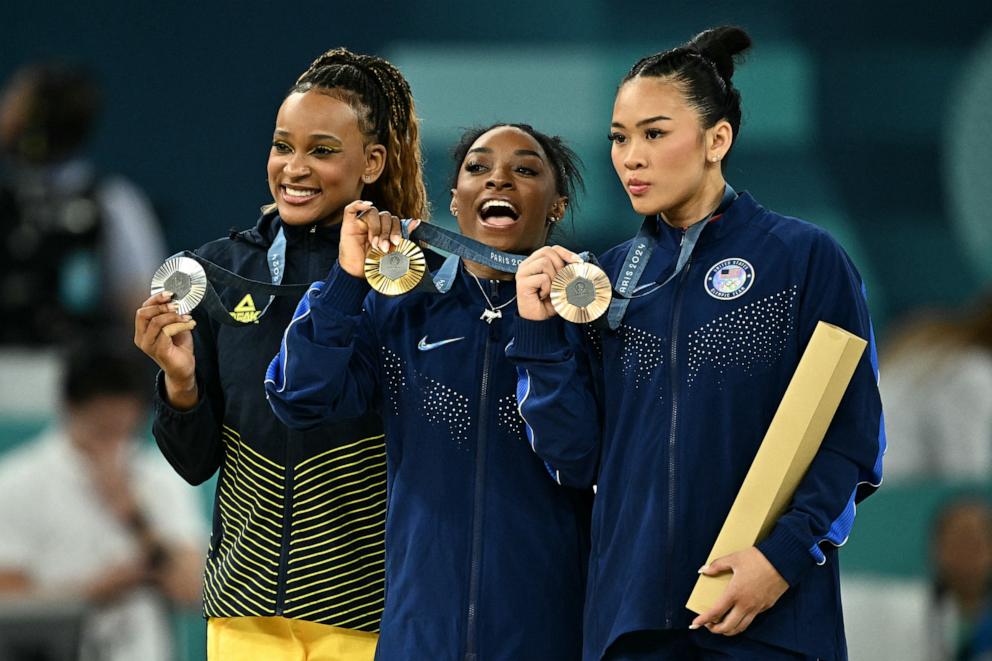 PHOTO: Silver medalist Rebeca Andrade of Brazil, gold medalist Simone Biles and bronze medalist Sunisa Lee of the U.S. pose with their medals after the artistic gymnastics women's all-around final at the 2024 Paris Olympics, Aug. 1, 2024.