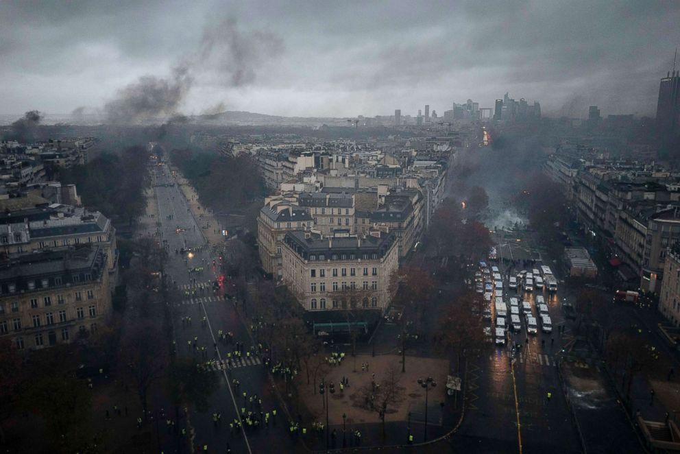 PHOTO: Avenues leading to the Arc de Triomphe are viewed from the top of the Arc de Triomphe on the Champs-Elysees during a demonstration, Dec.1, 2018 in Paris. A  protest turned into a riot as police fired tear gas in street battles with activists.