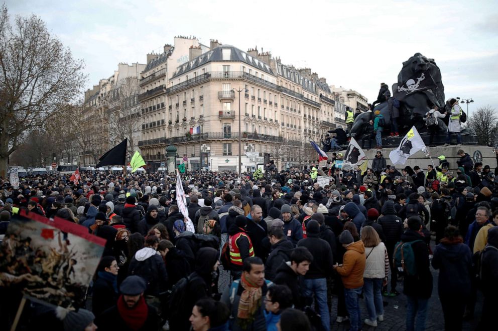 PHOTO: Protesters gather near the sculpture "Le lion de Belfort", located Denfert-Dochereau place, during a demonstration against French government's pensions reform plans in Paris, Dec. 10, 2019.