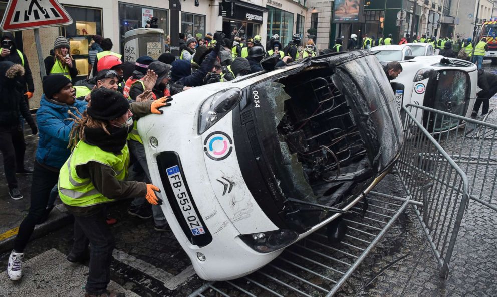 PHOTO: Demonstrators destroy cars during a protest of Yellow vests against rising oil prices and living costs, near the Champs Elysees in Paris, Dec. 1, 2018.