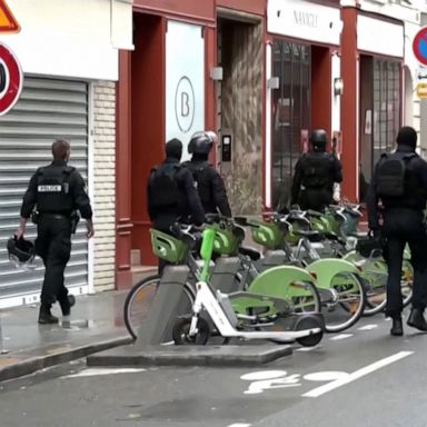 Dozens of protesters wearing face masks held a demonstration in front of the U.S. Embassy in Paris.