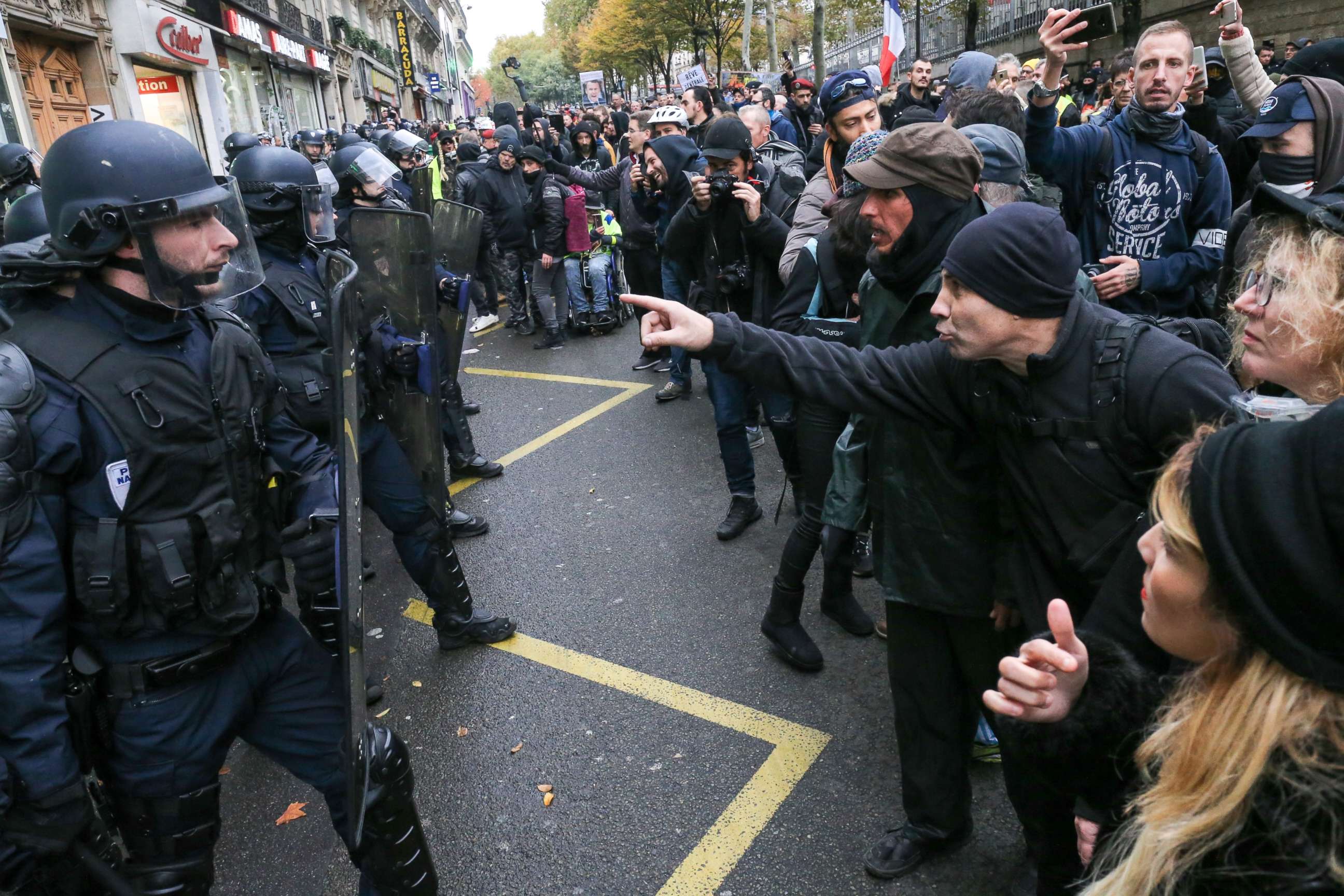 PHOTO: French anti-riot policemen face protesters during a demonstration marking the first anniversary of the ''yellow vest'' (gilets jaunes) movement in Paris on November 16, 2019.