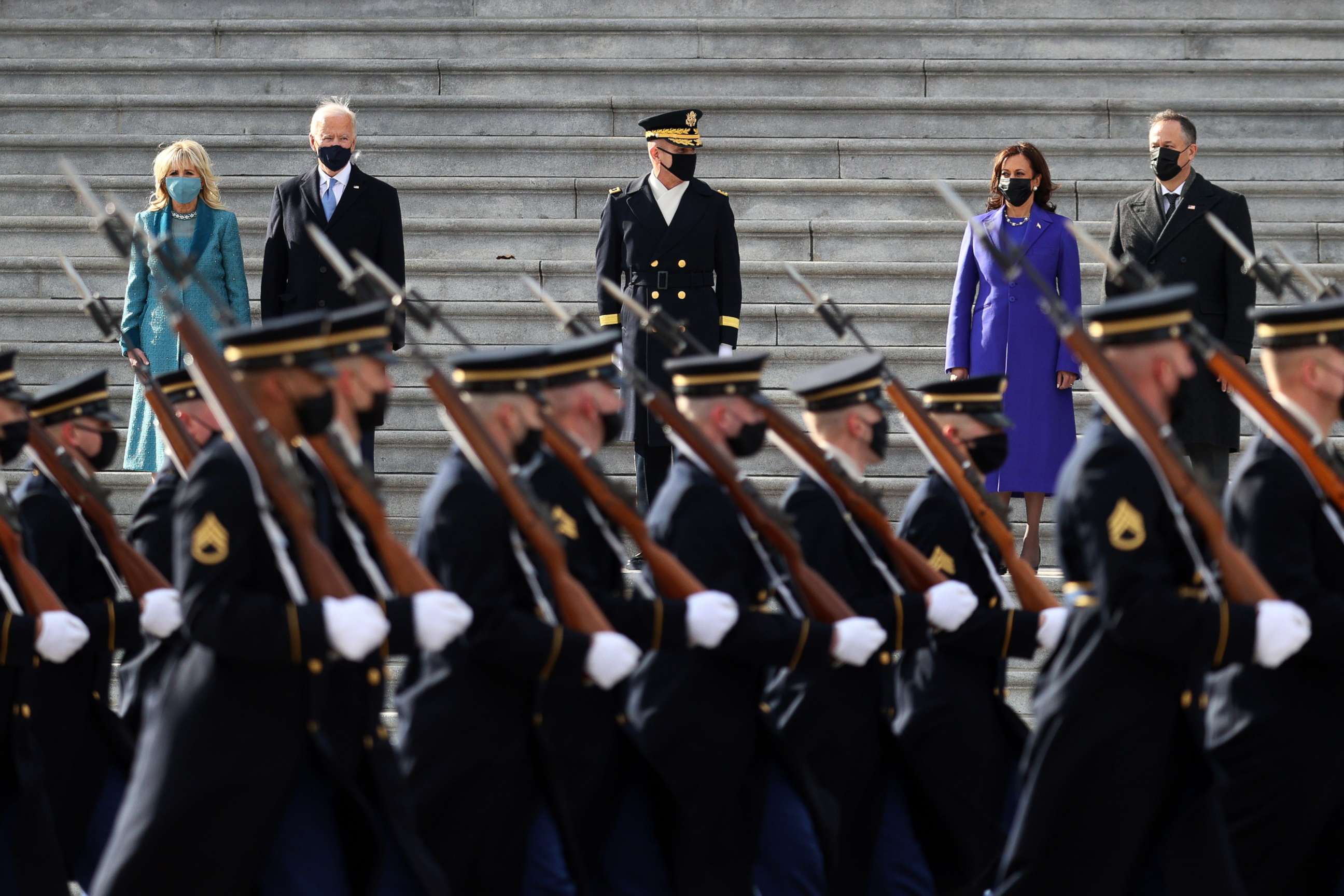 PHOTO: President Joe Biden, first lady Jill Biden, Vice President Kamala Harris and Douglas Emhoff attend a Pass in Review ceremony on the East Front of the U.S. Capitol after the 59th Presidential Inauguration on Jan. 20, 2021, in Washington.
