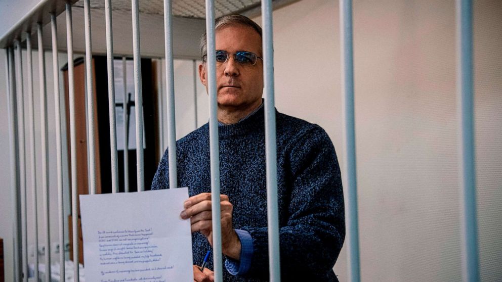 PHOTO: In this Oct. 24, 2019, file photo, Paul Whelan, a former US Marine accused of espionage and arrested in Russia in December 2018, holds a message as he stands inside a defendants' cage before a hearing at the Lefortovo Court in Moscow.