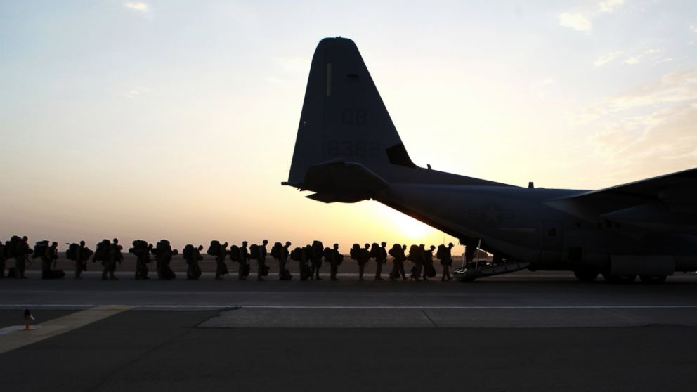 Marines and sailors with Marine Expeditionary Brigade in Afghanistan load onto a KC-130 aircraft at Camp Bastion, Helmand Province, Afghanistan, Oct. 27, 2014. 
