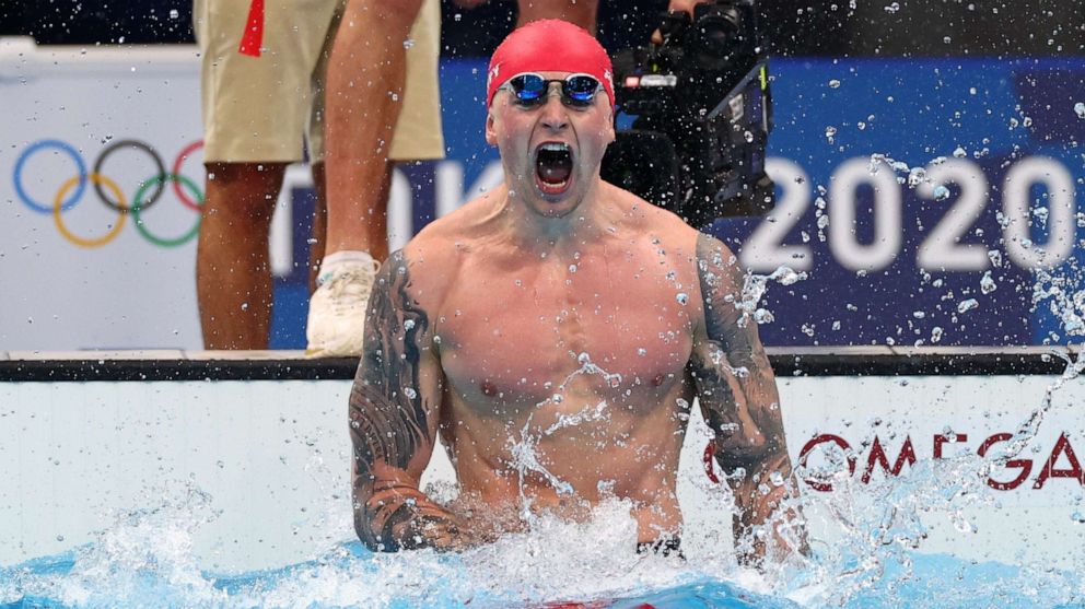 PHOTO: Adam Peaty of Britain reacts after winning the gold medal in the 100m breaststroke on July 26, 2021, in Tokyo.