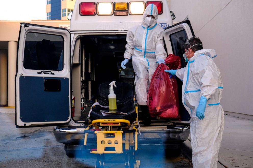 PHOTO: EMTs cleanse their materials outside Memorial West Hospital where coronavirus (COVID-19) patients are treated, in Pembroke Pines, Fla., July 13, 2020.