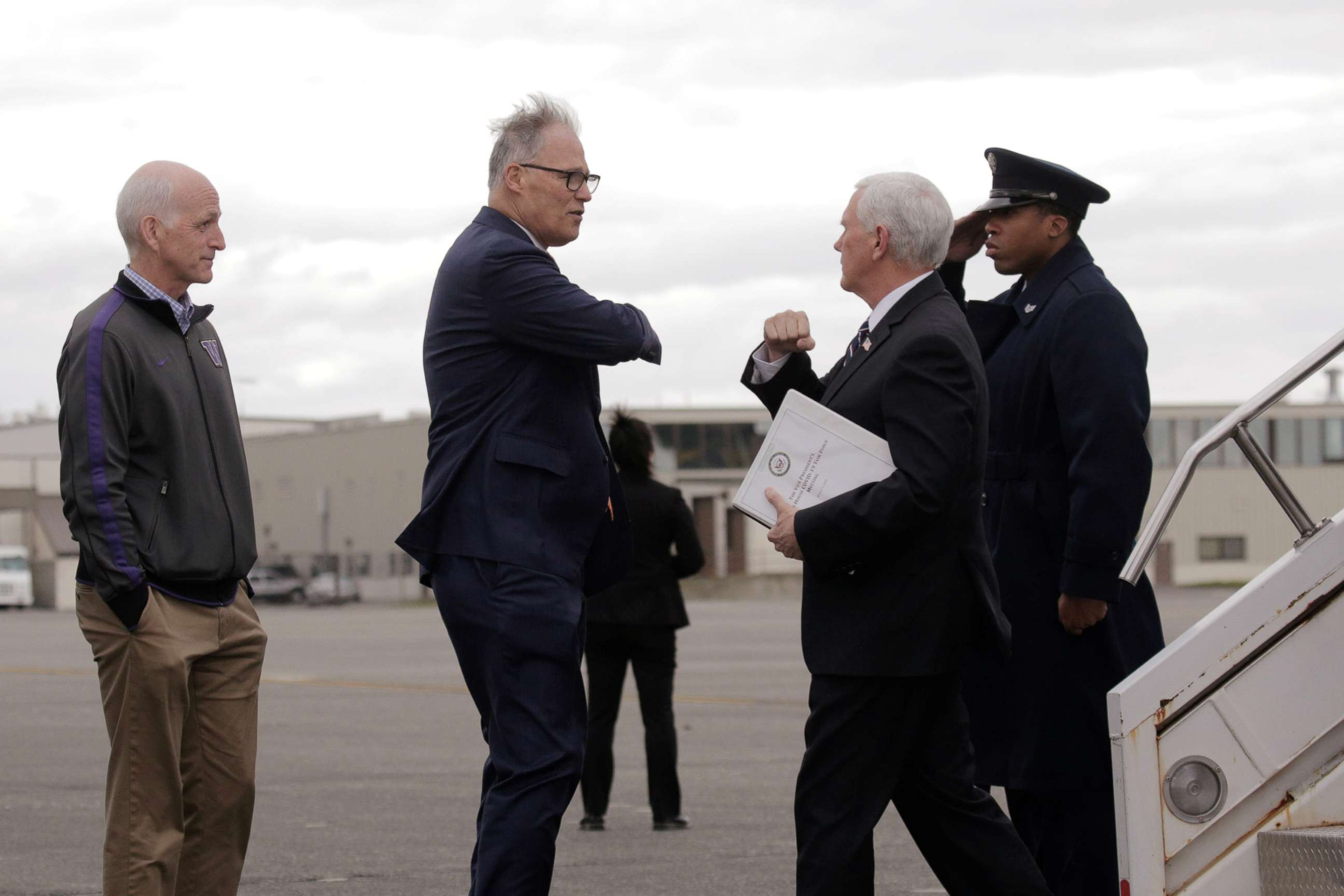 PHOTO: Governor Jay Inslee greets Vice President Mike Pence, who heads the government's coronavirus task force, with an elbow bump at Joint Base Lewis-McChord near Tacoma, Washington, March 5, 2020.