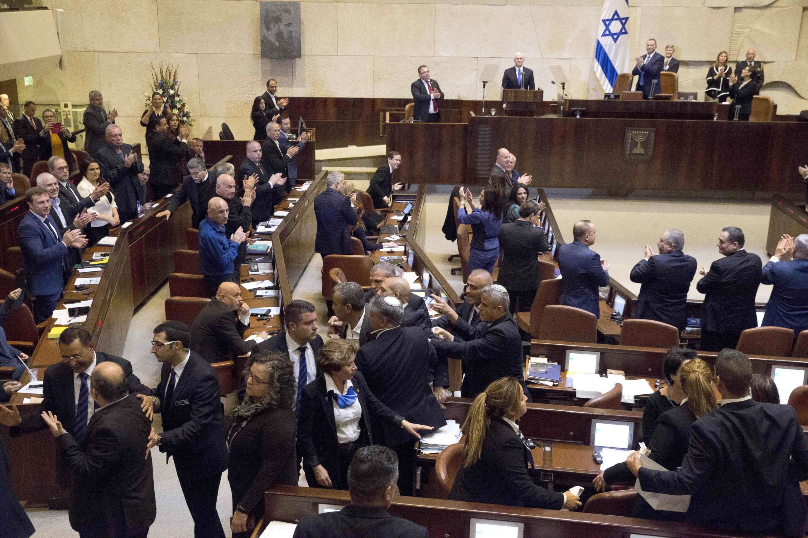 PHOTO: Israel's Arab parliamentary bloc and Knesset members scuffle with security after they held signs in protest during the speech of U.S. Vice President Mike Pence in Israel's parliament in Jerusalem, Jan. 22, 2018.