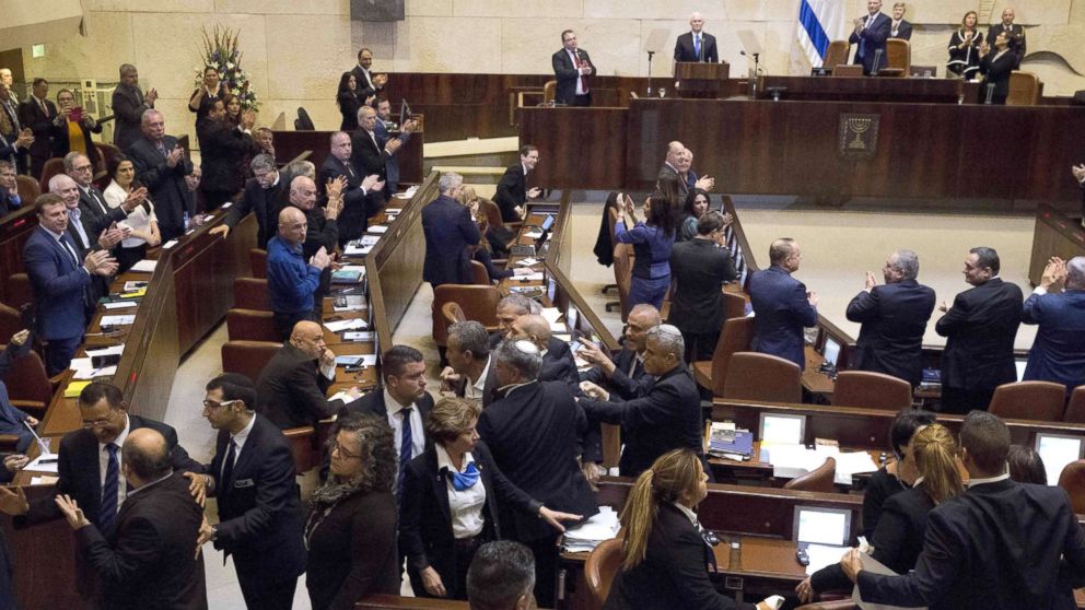 PHOTO: Israel's Arab parliamentary bloc and Knesset members scuffle with security after they held signs in protest during the speech of U.S. Vice President Mike Pence in Israel's parliament in Jerusalem, Jan. 22, 2018.