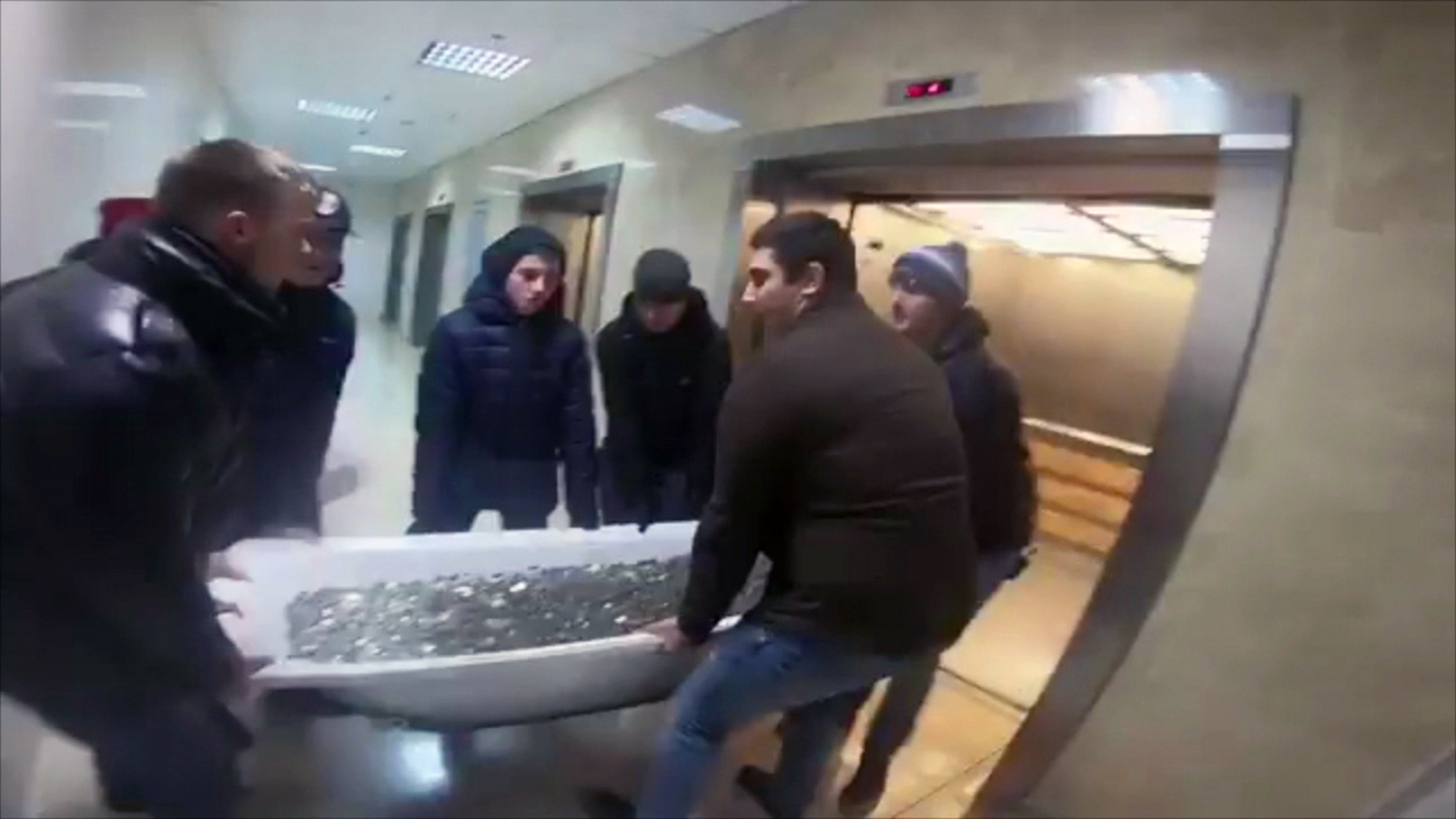 PHOTO: A group of people dragged a bathtub full of coins to a shopping mall in Moscow to buy an iPhone XS, on Nov. 13, 2018.