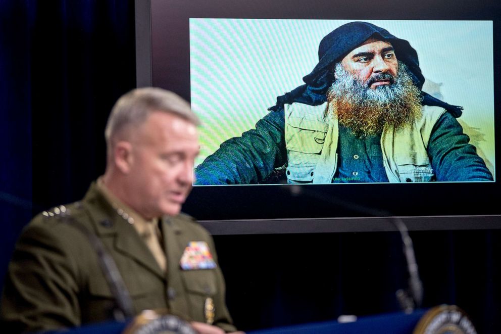 PHOTO: Abu Bakr al-Baghdadi is displayed on a monitor as U.S. Central Command Commander Marine Gen. Kenneth McKenzie at a joint press briefing at the Pentagon in Washington, Wednesday, Oct. 30, 2019, on the Abu Bakr al-Baghdadi raid.