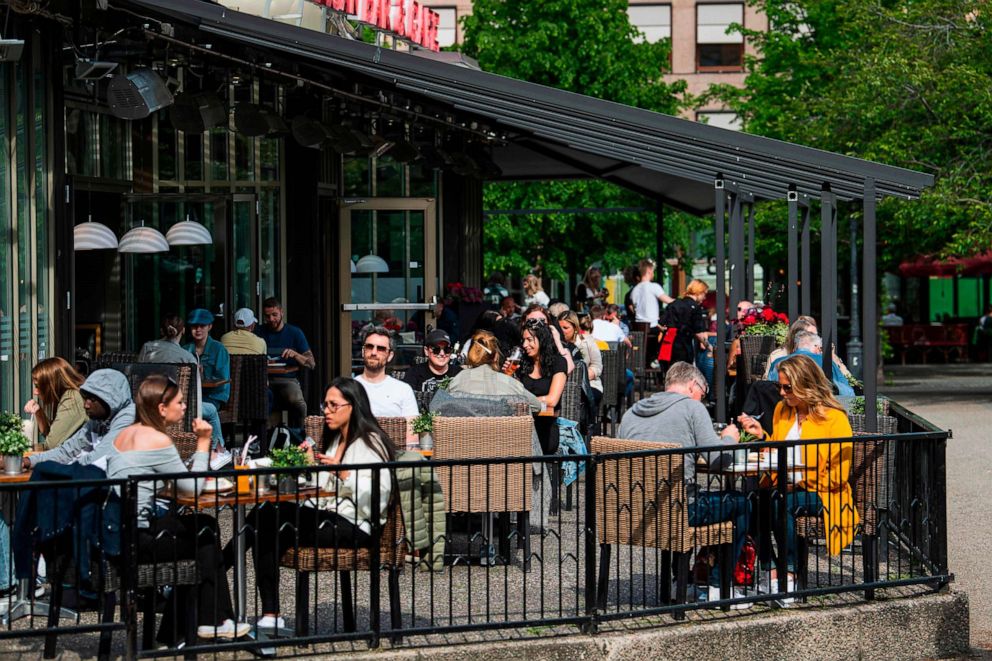 PHOTO: People sit in a restaurant in Stockholm, Sweden, on May 29, 2020, amid the coronavirus pandemic.