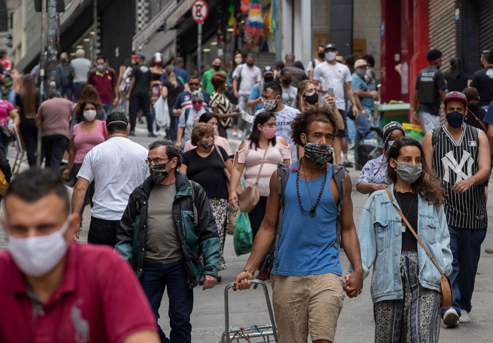 PHOTO: People walk through a downtown shopping district in Sao Paulo, Brazil, on June 10, 2020.