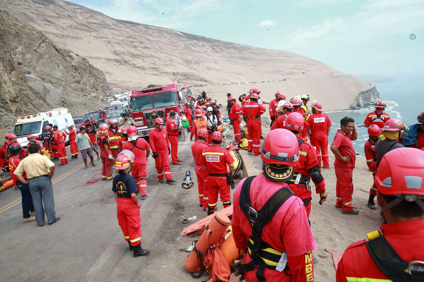 PHOTO: A picture released by Peruvian agency Andina shows firefighters and rescuers working during rescue efforts after a bus plunged over a cliff after colliding with a truck on a coastal highway near Pasamayo, on Jan. 2, 2018.