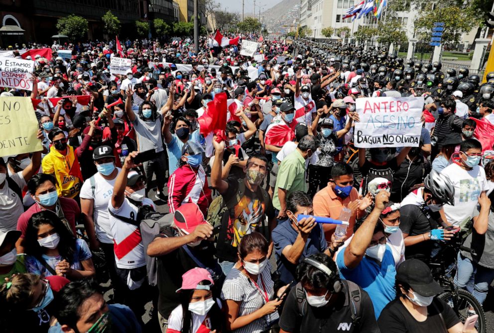 PHOTO: People react after Peru's interim President Manuel Merino announced his resignation, in Lima, Peru, Nov. 15, 2020.