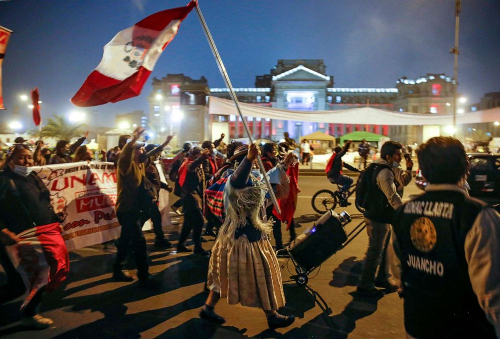 PHOTO: Supporters Pedro Castillo celebrate in downtown Lima following the official proclamation of him as Peru's president-elect, July 19, 2021. 
