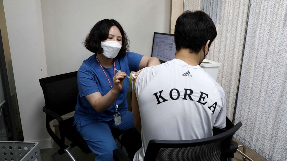 PHOTO: South Korean Olympic judo team member An Ba-ul receives the first dose of the Pfizer-BioNTech Covid-19 coronavirus vaccine at the National Medical Center in Seoul, April 29, 2021.
