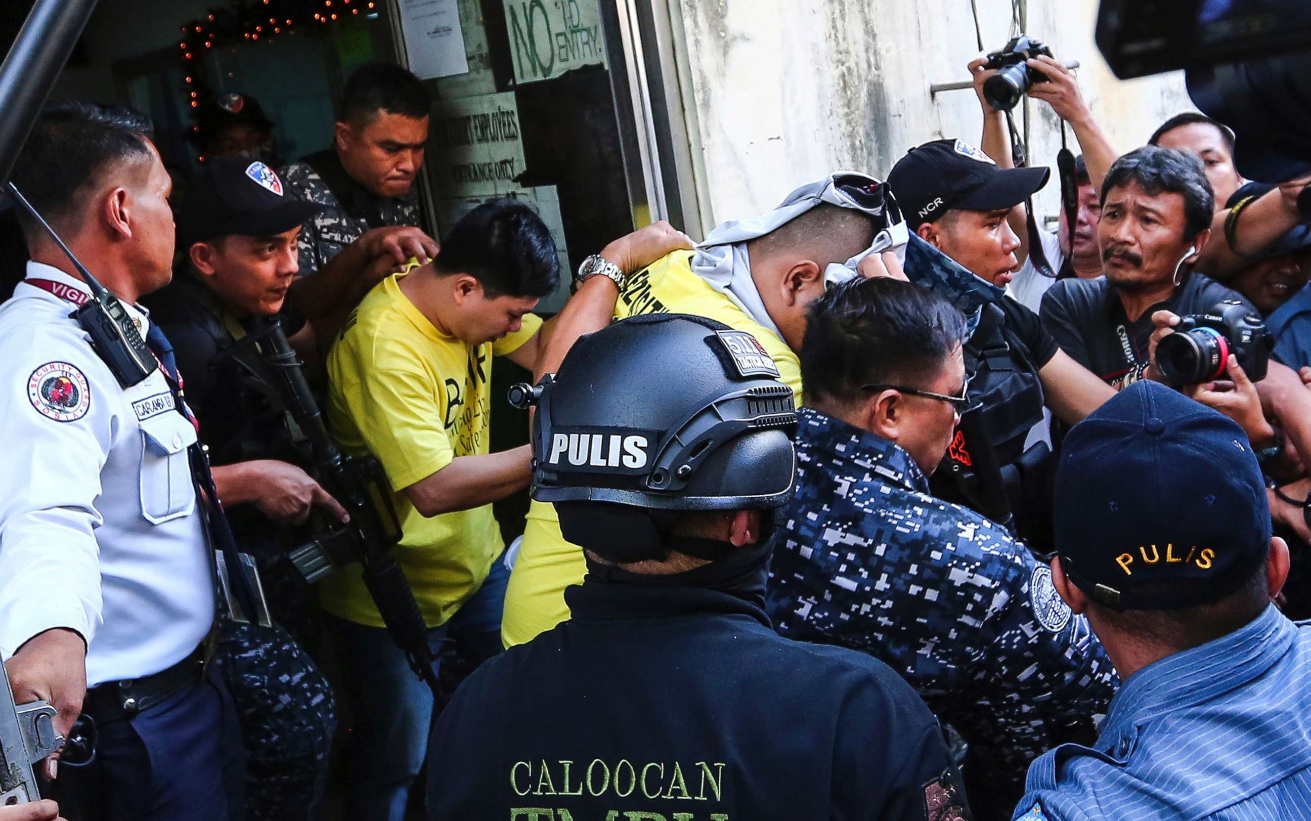 PHOTO: Two of three police officers are escorted out of the courtroom after being found guilty and sentenced up to 40 years without parole for the killing of a student, Nov. 29, 2018, in Caloocan city, Philippines.