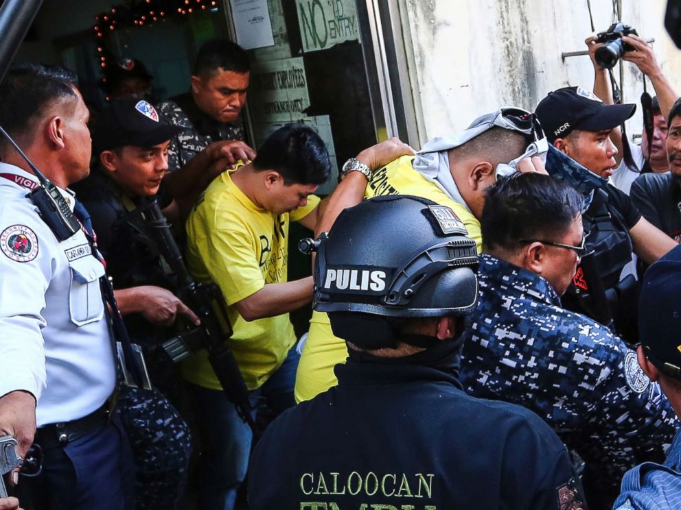 PHOTO: Two of three police officers are escorted out of the courtroom after being found guilty and sentenced up to 40 years without parole for the killing of a student, Nov. 29, 2018, in Caloocan city, Philippines.