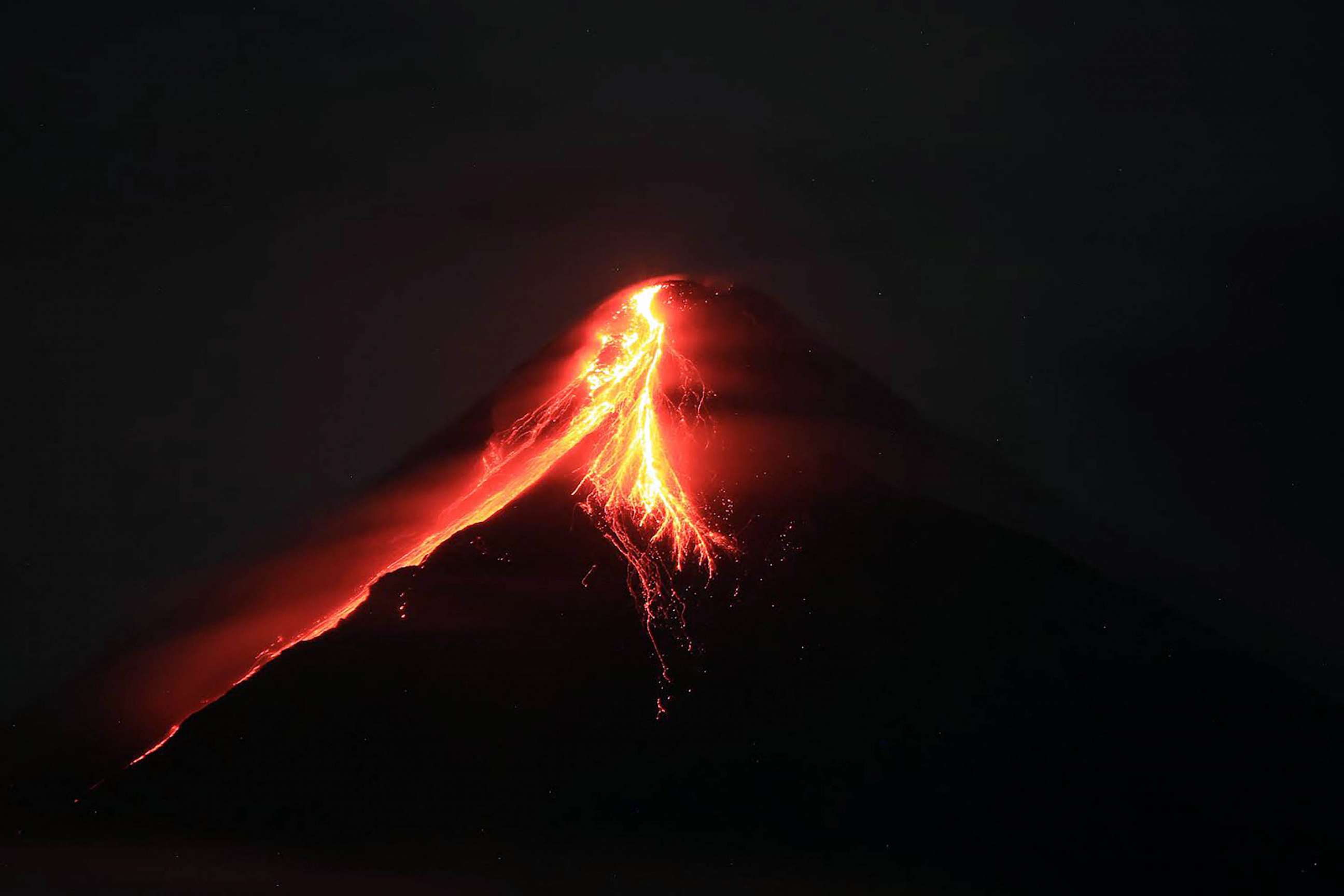 volcano explosion at night